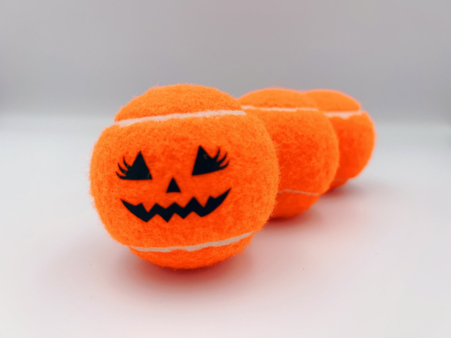 Three Haunted Halloween Tennis Balls