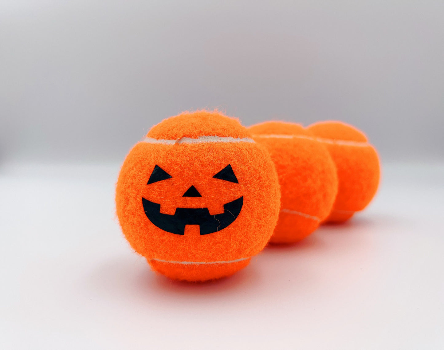 Three Haunted Halloween Tennis Balls