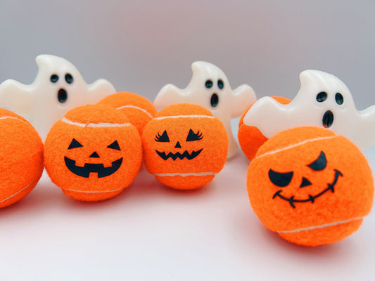 Three Haunted Halloween Tennis Balls